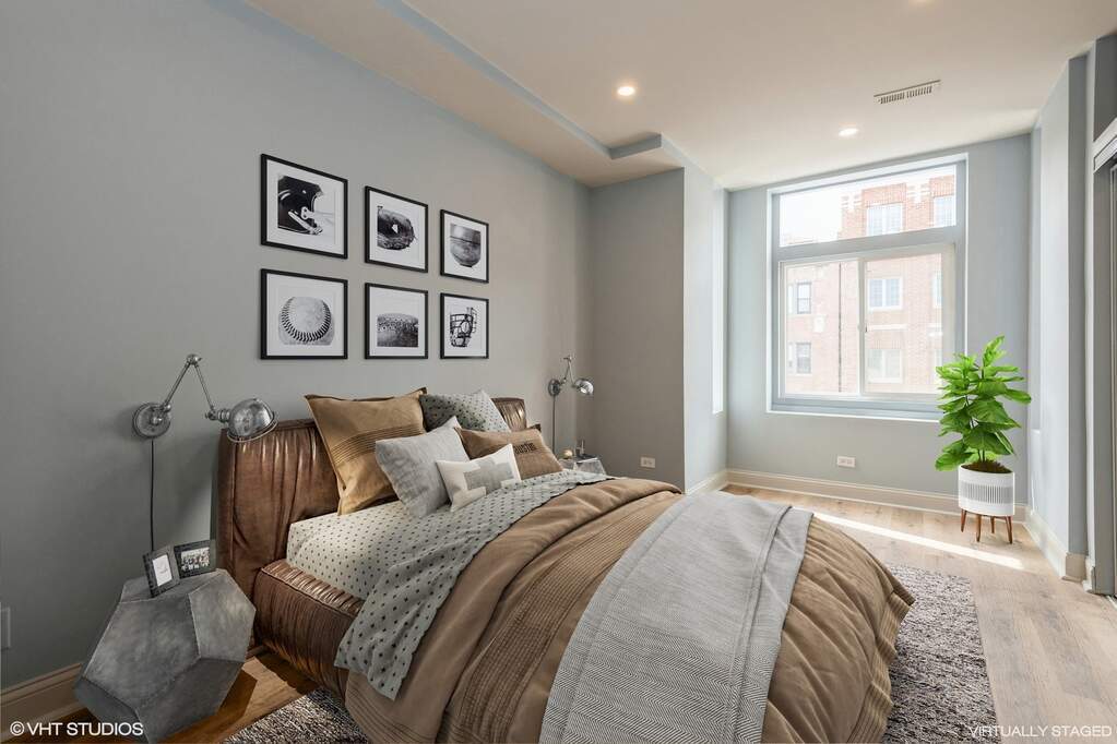 1446 West Irving Park Road, Unit 2 Chicago, IL 60613 - Photo 11 of 23 a bedroom with a bed and a window