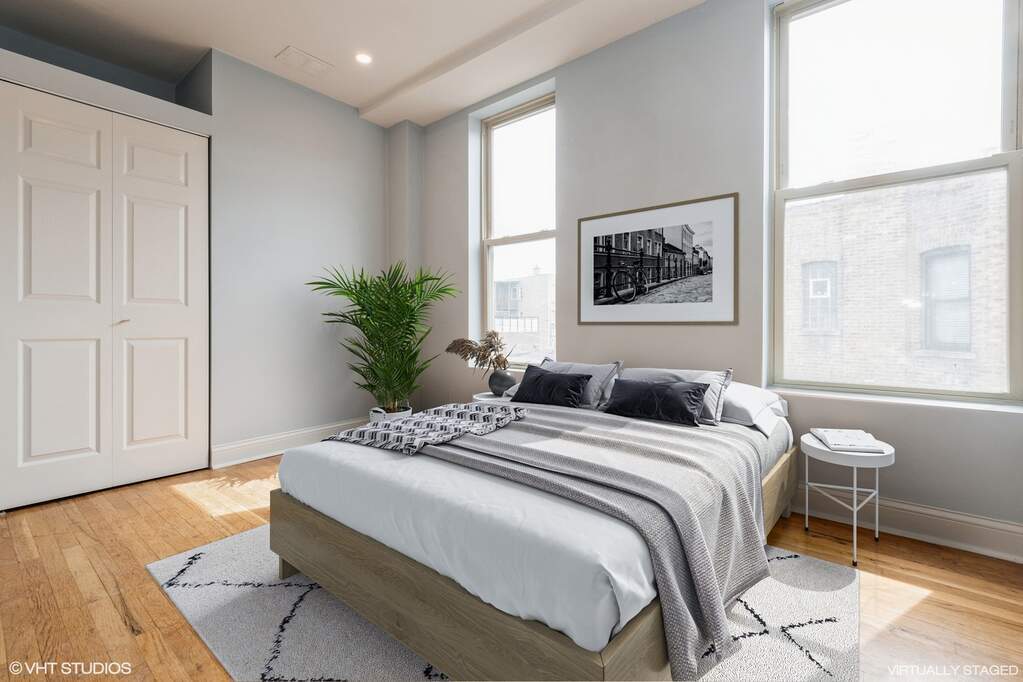1446 West Irving Park Road, Unit 2 Chicago, IL 60613 - Photo 13 of 23 a bedroom with a bed and a window