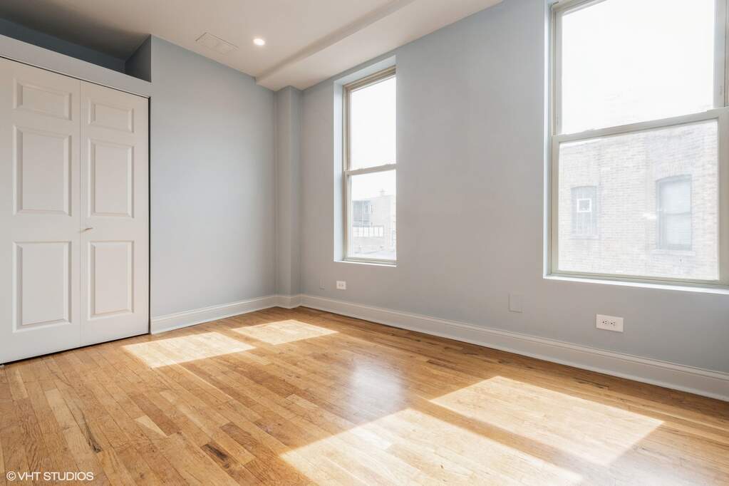 1446 West Irving Park Road, Unit 2 Chicago, IL 60613 - Photo 15 of 23 a view of an empty room and window