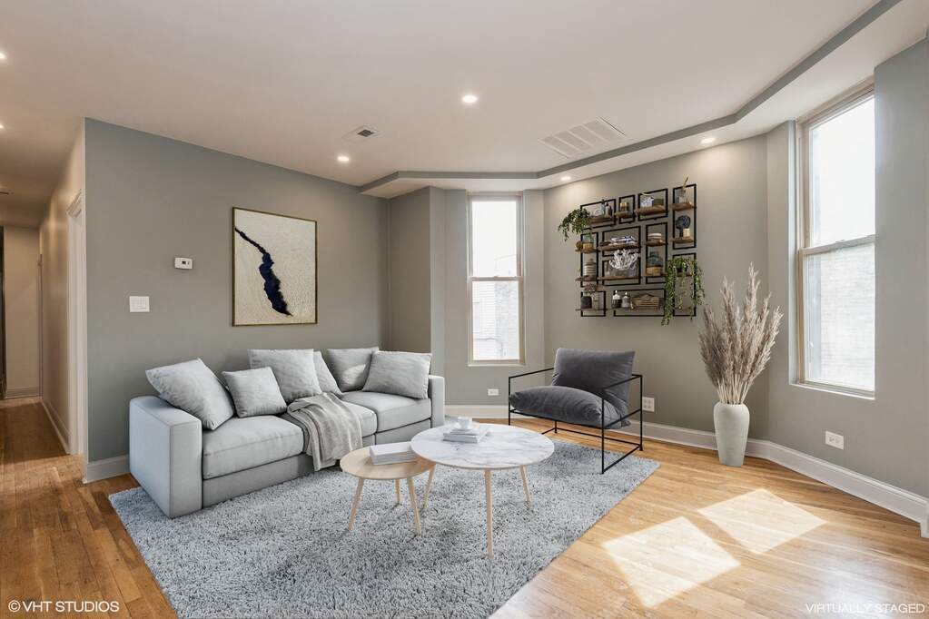 1446 West Irving Park Road, Unit 2 Chicago, IL 60613 - Photo 5 of 23 a living room with furniture and a large window