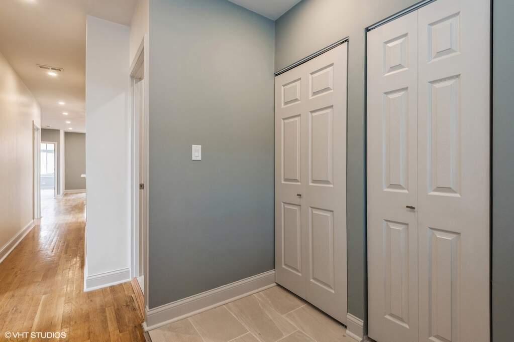 1446 West Irving Park Road, Unit 2 Chicago, IL 60613 - Photo 10 of 23 a view of a hallway with wooden floor