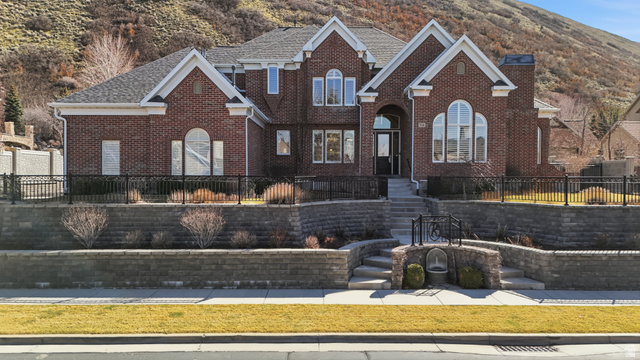 714 Draper Heights Way Draper, UT 84020 - Photo 4 of 88 View of front of house with brick siding and a shingled roof