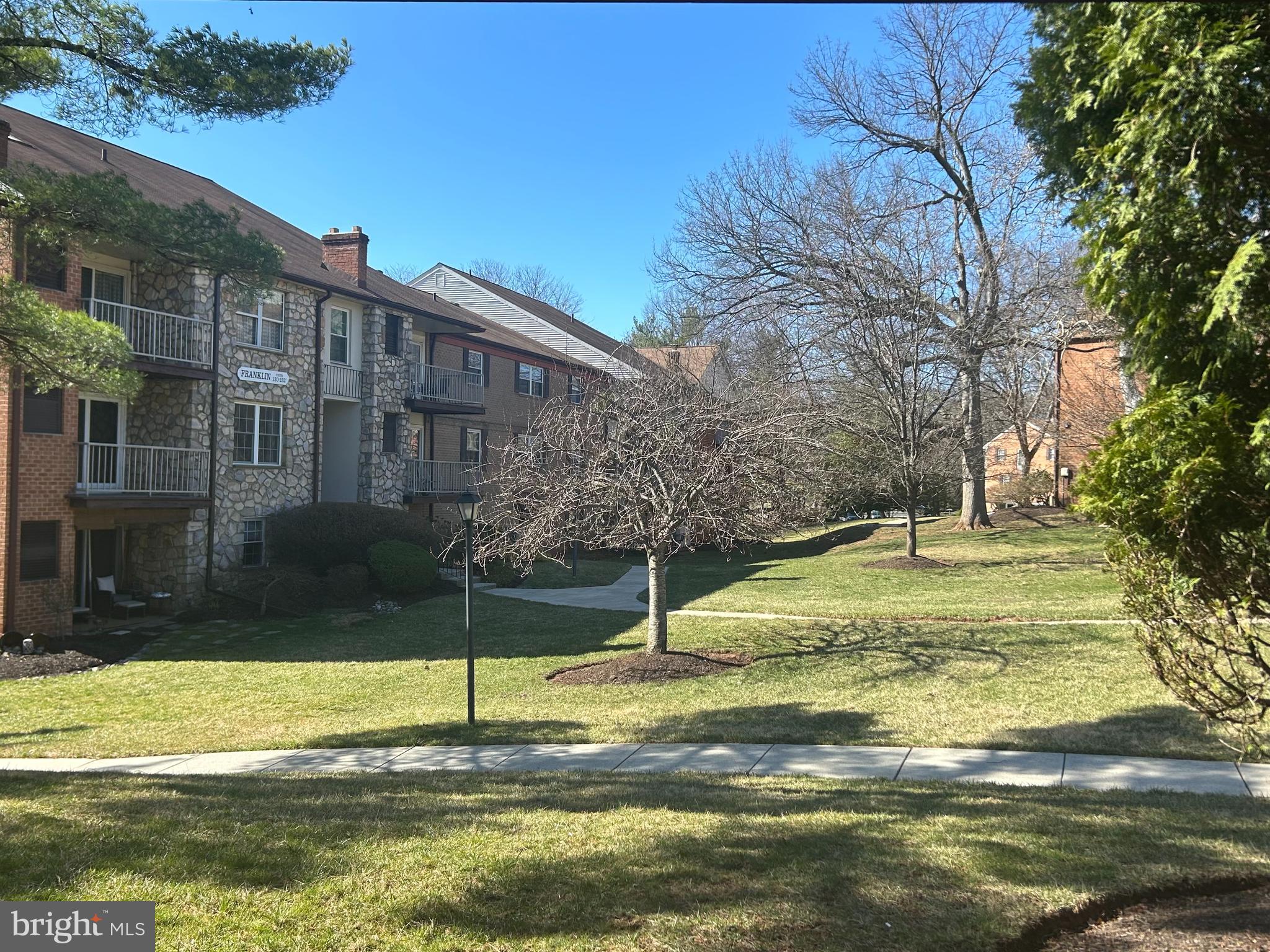 a swimming pool with outdoor seating and yard