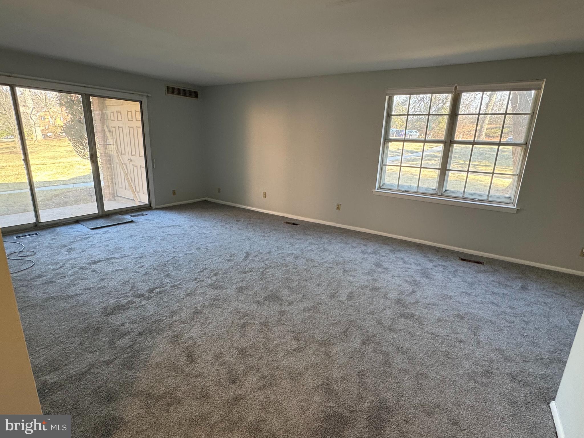 115 Drummers Lane Wayne, PA 19087 - Photo 4 of 11 an empty room with windows