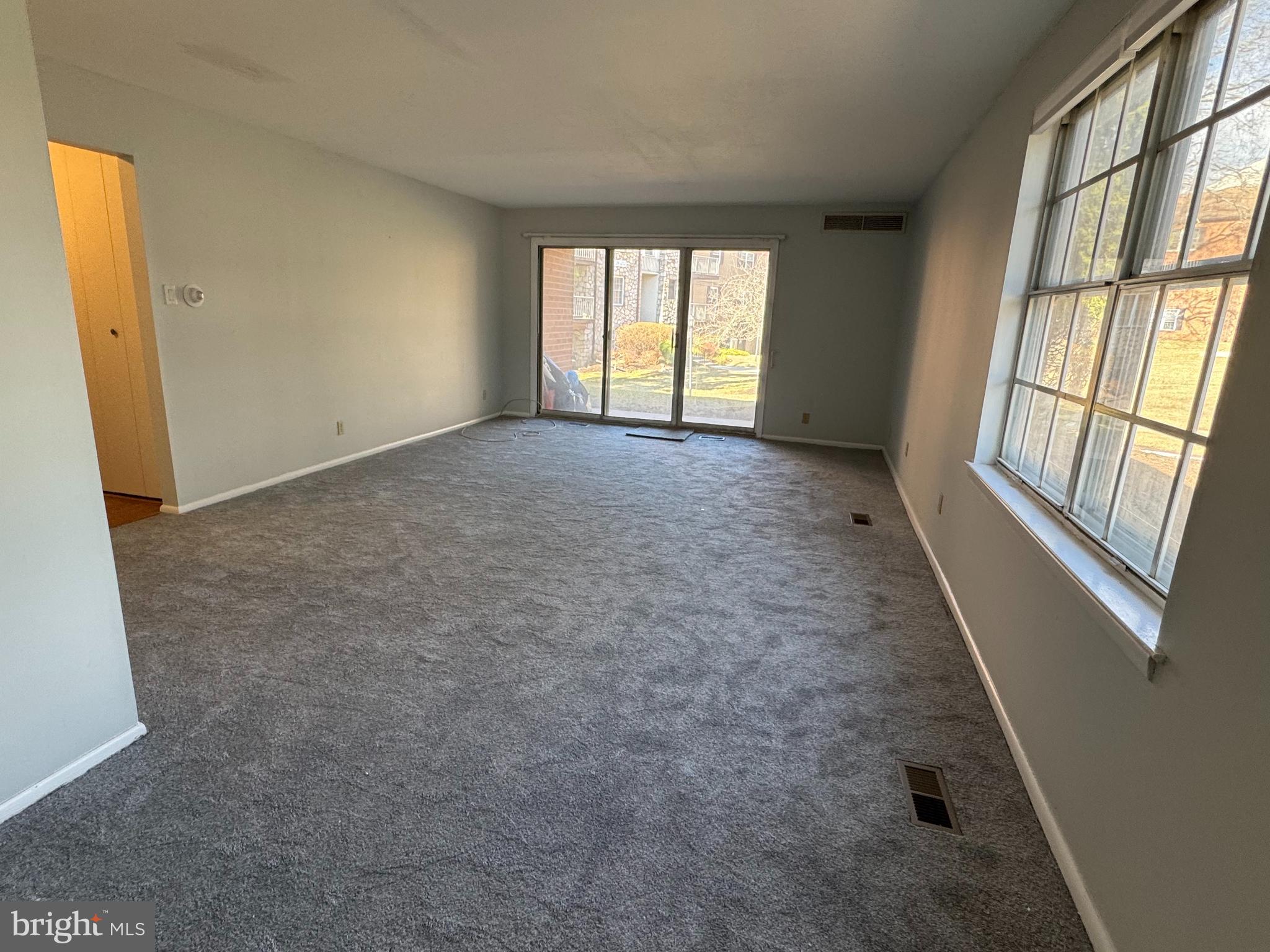 115 Drummers Lane Wayne, PA 19087 - Photo 5 of 11 an empty room with windows