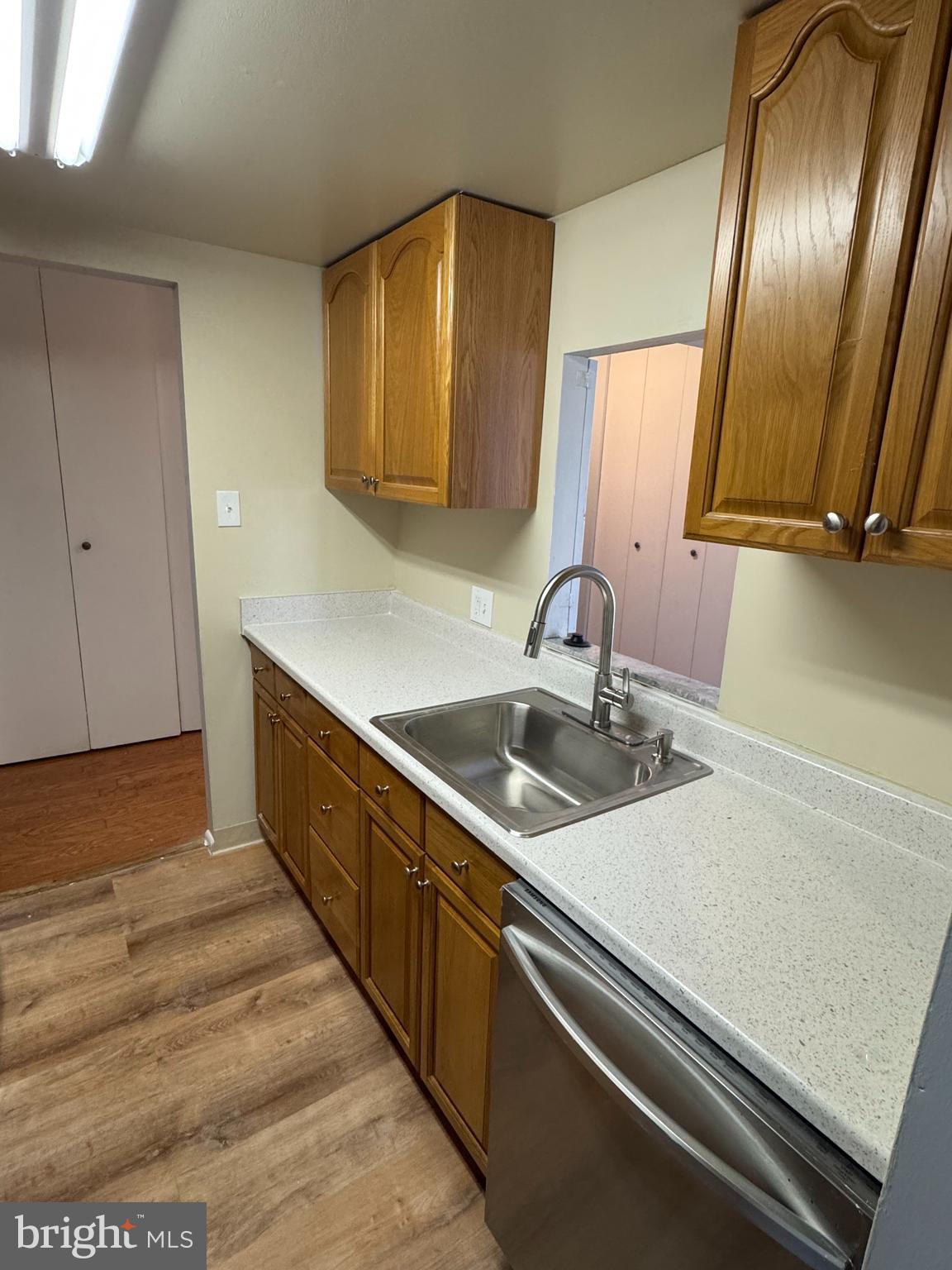 115 Drummers Lane Wayne, PA 19087 - Photo 8 of 11 a kitchen with stainless steel appliances sink and cabinets