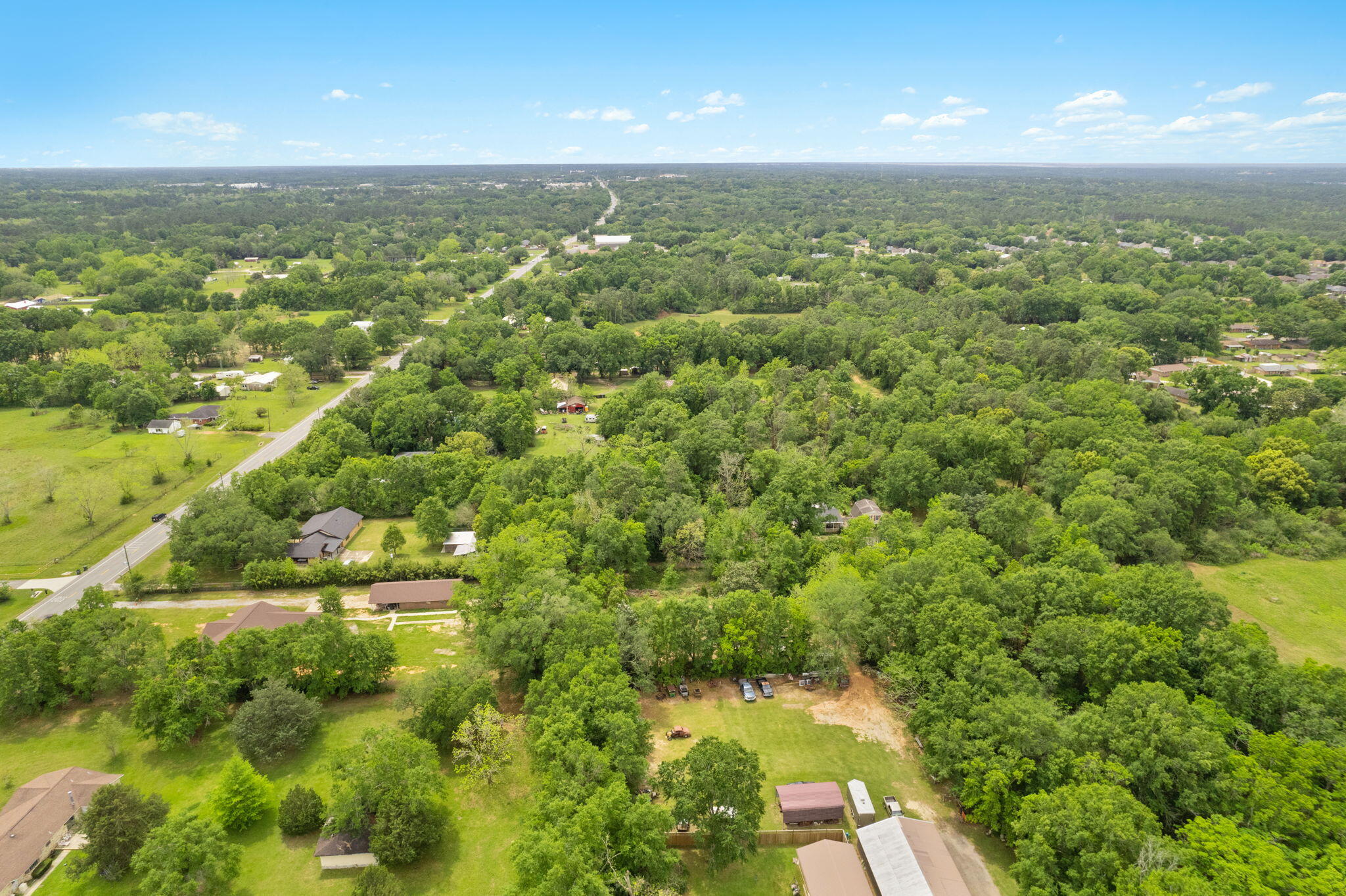2751 Pine Forest Road Cantonment, FL 32533 - Photo 11 of 13 an aerial view of residential houses with outdoor space and trees