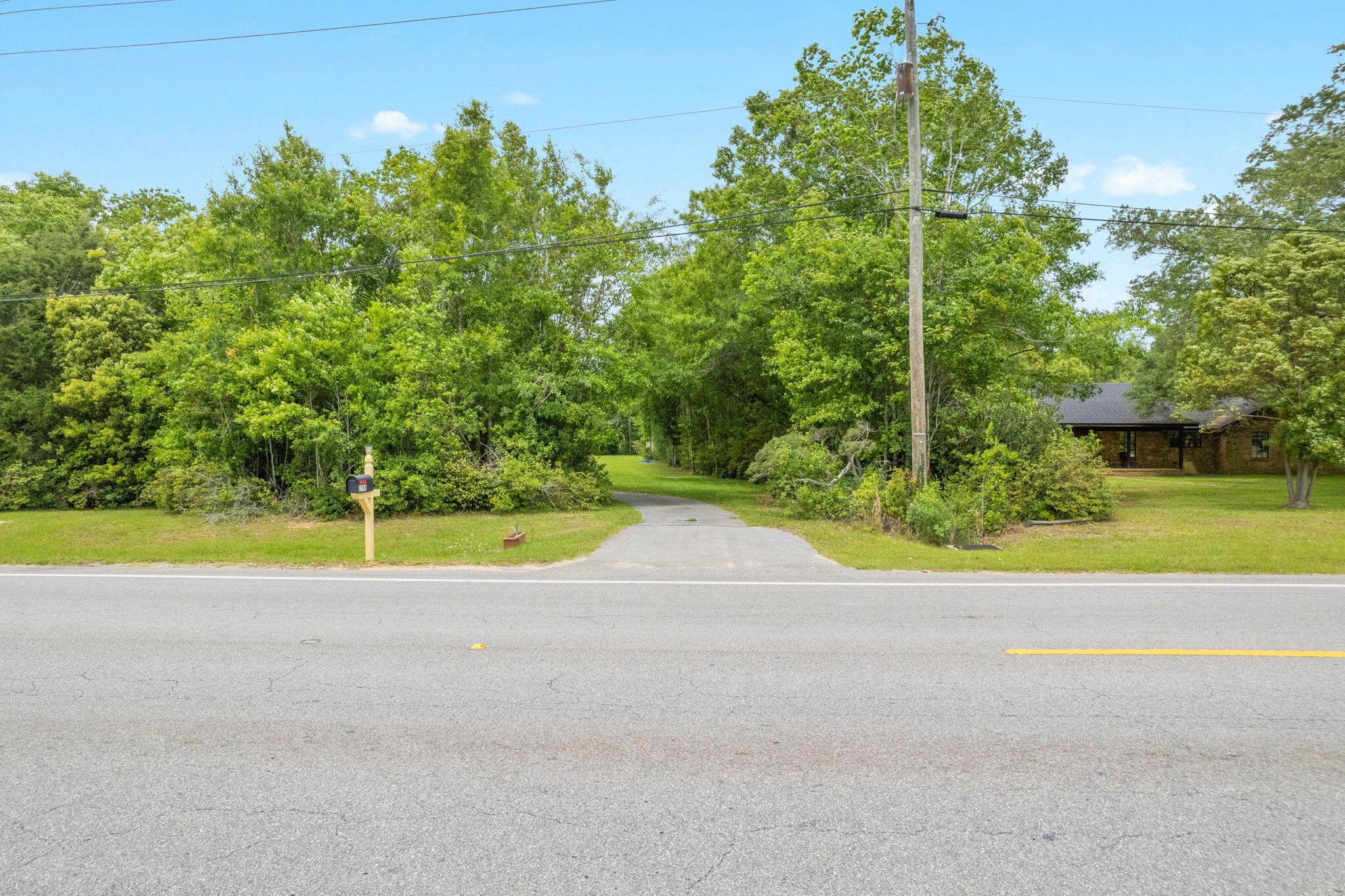 2751 Pine Forest Road Cantonment, FL 32533 - Photo 12 of 13 a view of a road with a yard