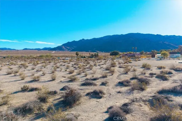 a view of a large body of water with a mountain in the background
