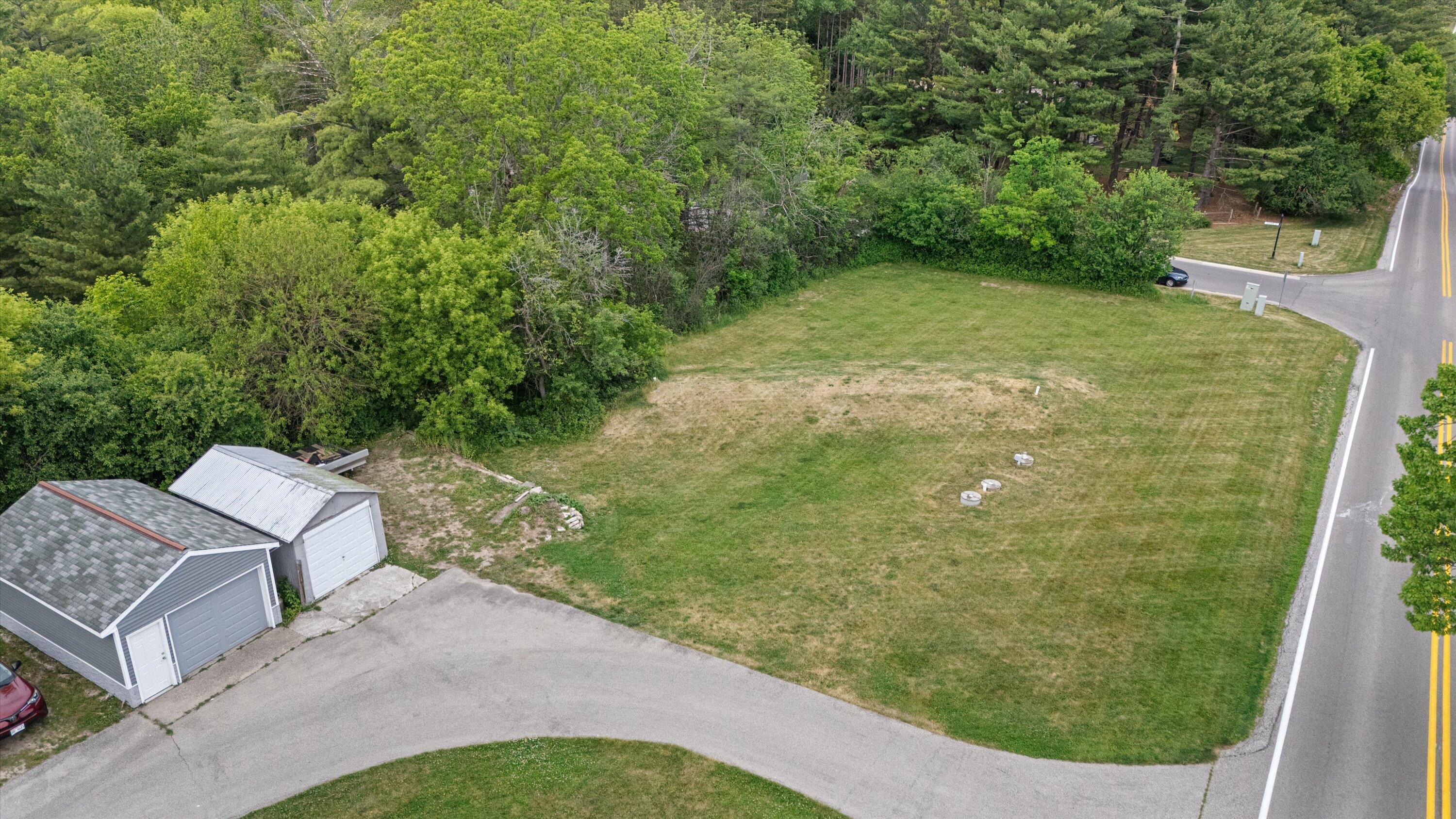 N68W29902 Hartling Road Merton, WI 53029 - Photo 35 of 40 Additional grass area past extra garages