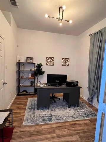 a living room with furniture and a rug