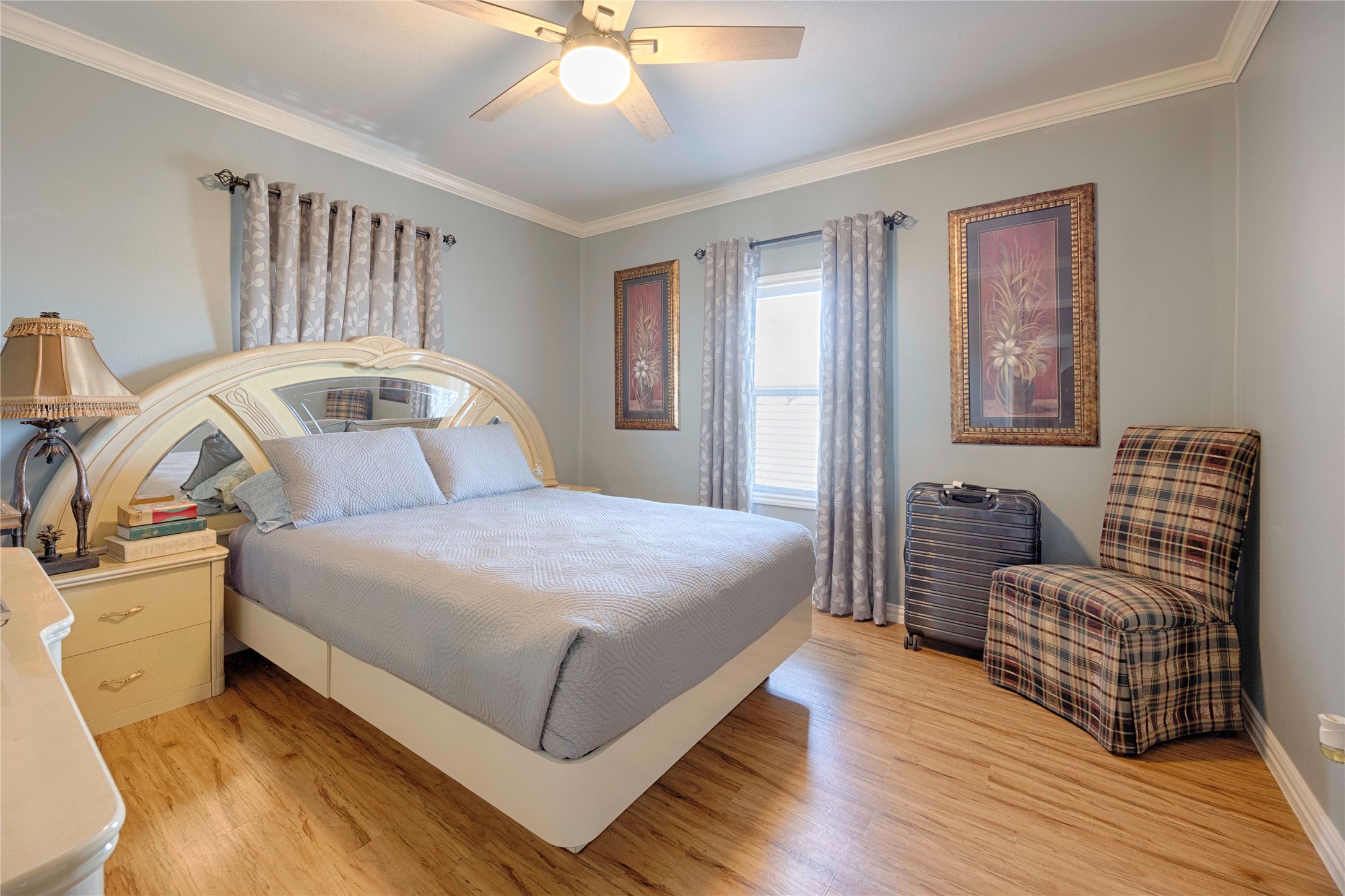 5135 Highway 90 Schulenburg, TX 78956 - Photo 18 of 32 a bedroom with a bed and wooden floor