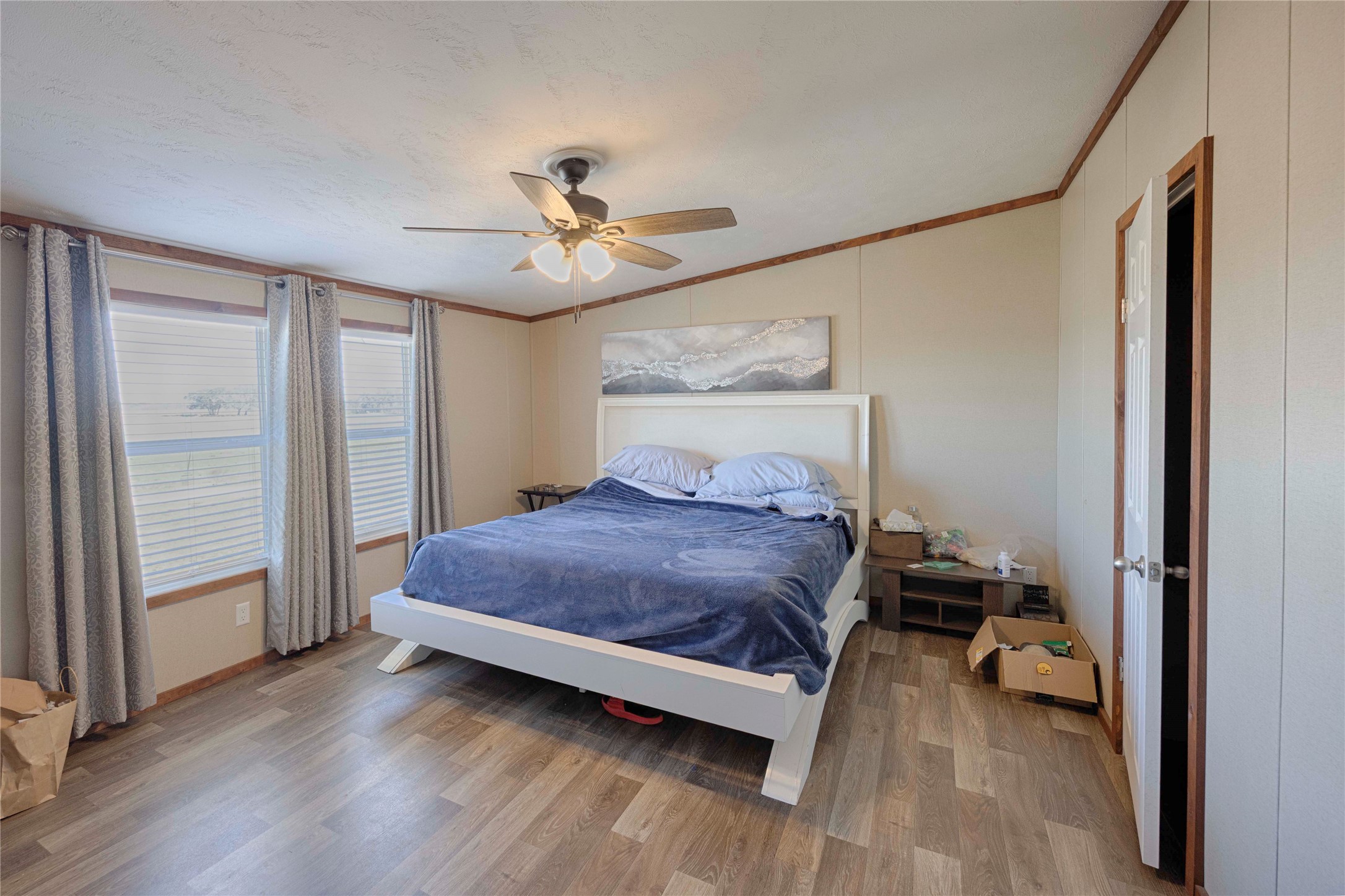 5135 Highway 90 Schulenburg, TX 78956 - Photo 31 of 32 a bedroom with a bed and a chandelier