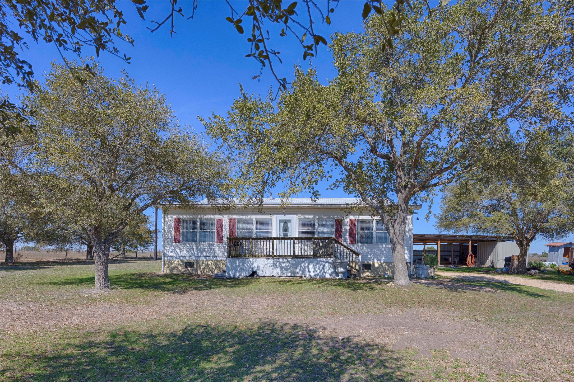5135 Highway 90 Schulenburg, TX 78956 - Photo 7 of 32 a view of a house with a yard