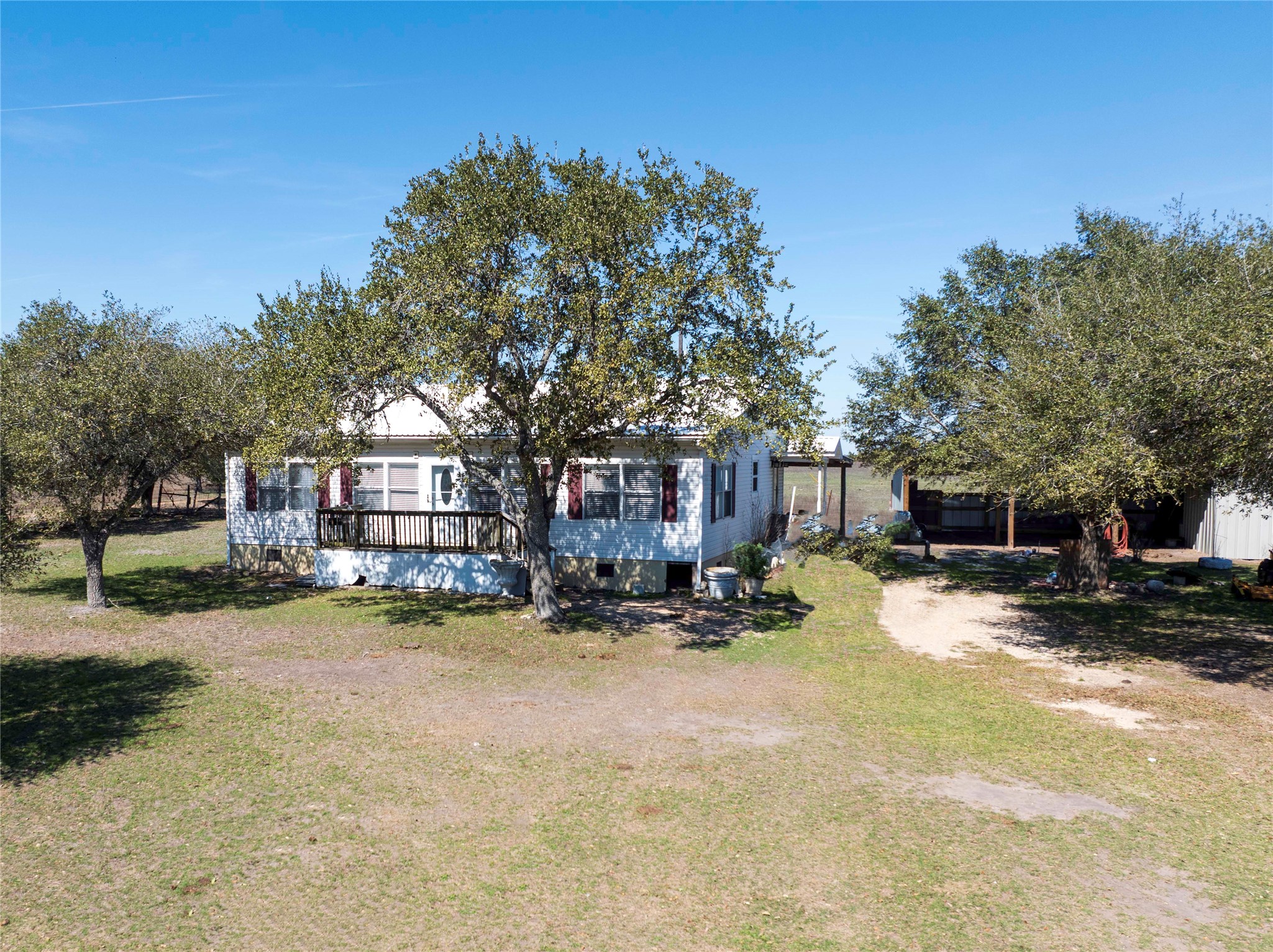 5135 Highway 90 Schulenburg, TX 78956 - Photo 8 of 32 a view of a house with a snow in a yard