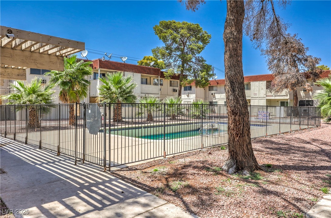 5404 South Swenson Street, Unit 34 Las Vegas, NV 89119 - Photo 23 of 28 Community pool featuring a patio area and a pergola