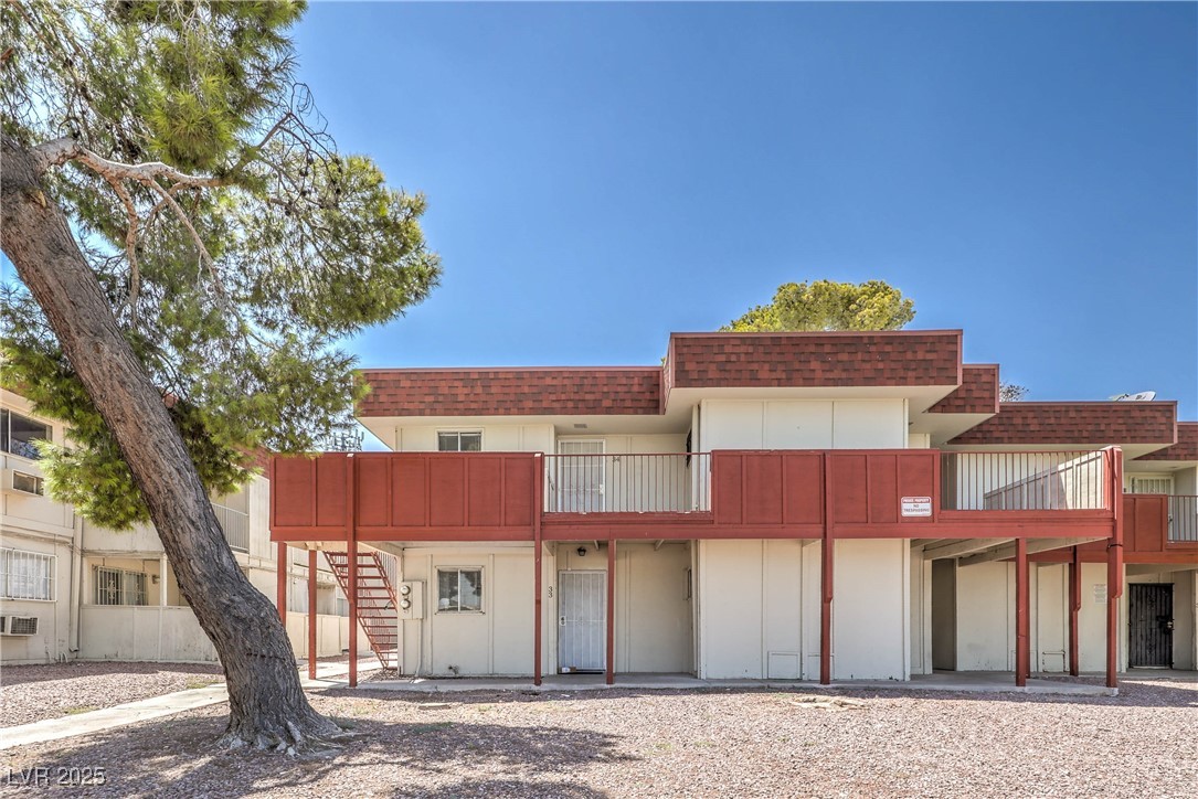 5404 South Swenson Street, Unit 34 Las Vegas, NV 89119 - Photo 24 of 28 View of building exterior with stairs