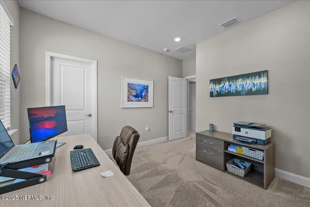 a bedroom with furniture and a book shelf