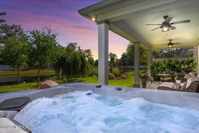 a view of swimming pool with a patio and a yard