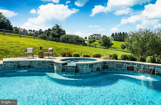 a kitchen with stainless steel appliances a stove a sink and a large window