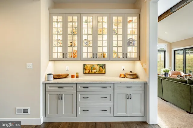 a view of a hallway view with wooden floor and staircase