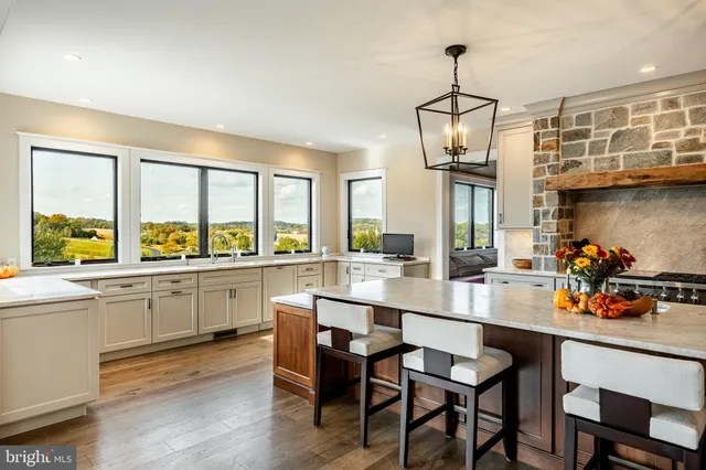 a very nice looking room with a large window and a rug