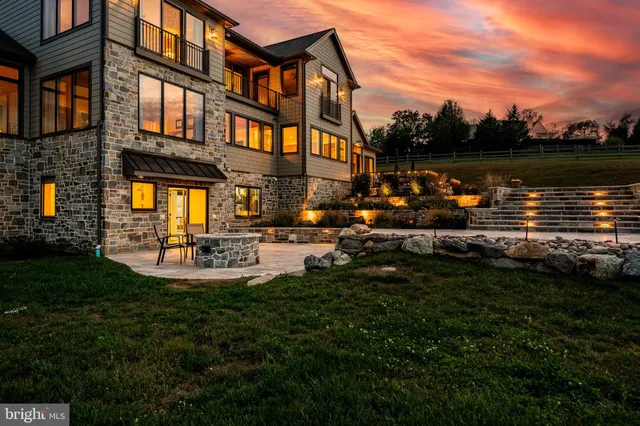 a view of a swimming pool with a patio and a garden