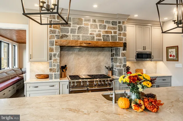 a bed sitting in a spacious bedroom next to a window