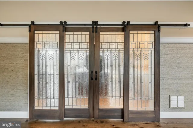 a bathroom with a glass shower door