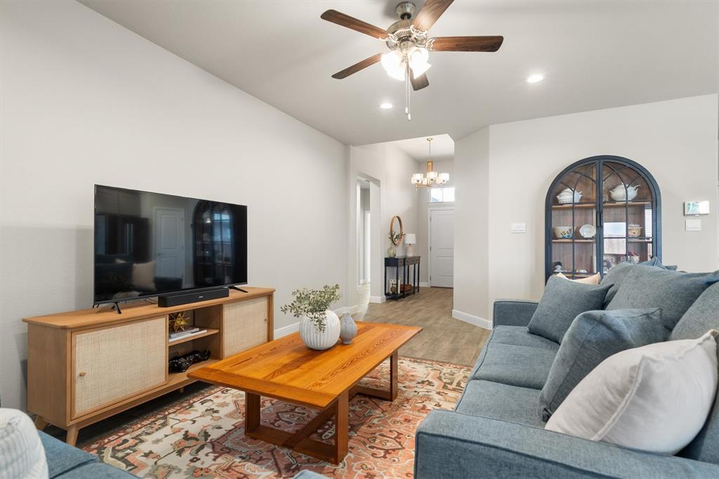 1864 Mensa Drive Haslet, TX 76052 - Photo 11 of 40 a living room with furniture and a flat screen tv