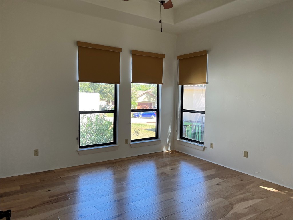 Undisclosed Address Austin, TX 78734 - Photo 10 of 21 an empty room with wooden floor and windows
