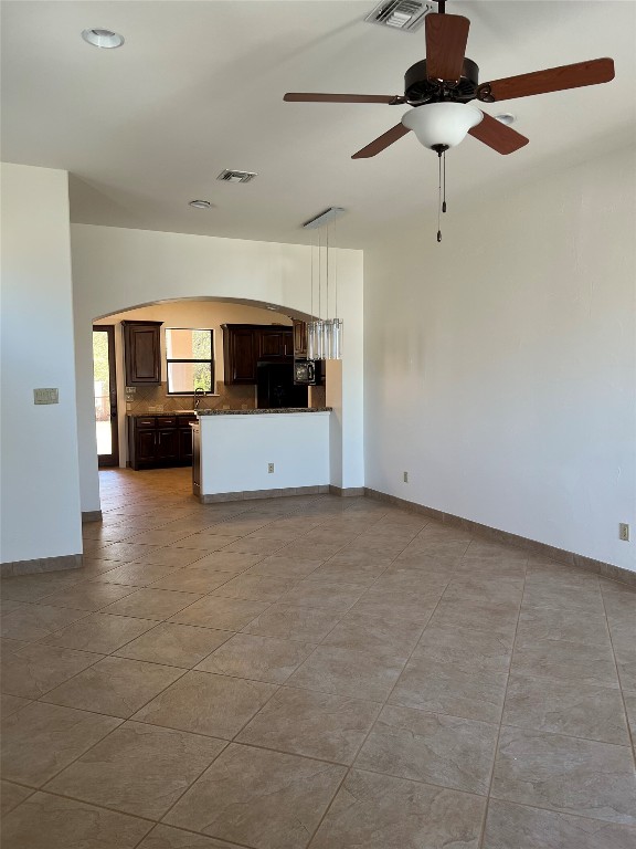 Undisclosed Address Austin, TX 78734 - Photo 4 of 21 a view of a livingroom with furniture and a ceiling fan