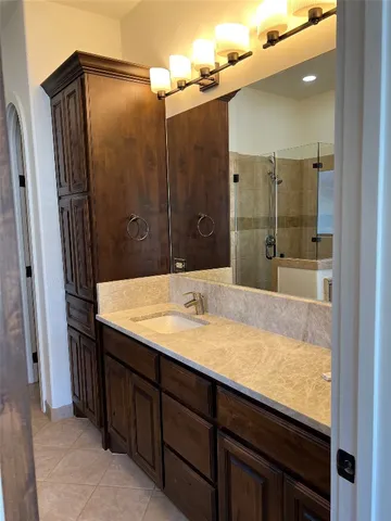 a bathroom with a tub and shower