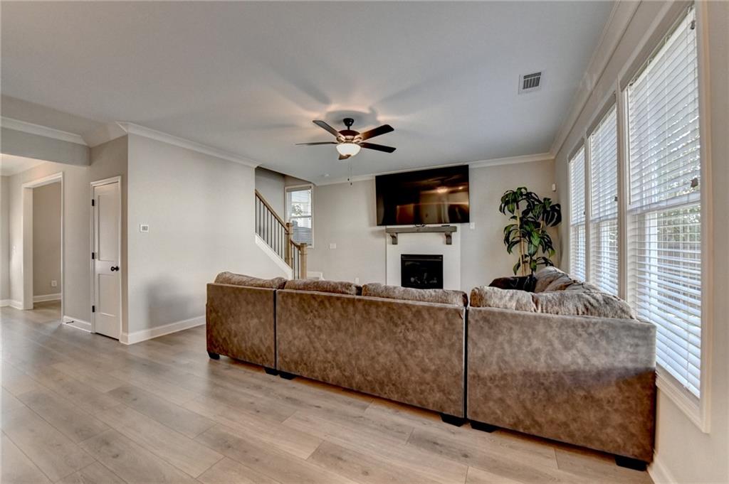 619 Garner Street Buford, GA 30518 - Photo 11 of 45 a living room with furniture and a flat screen tv