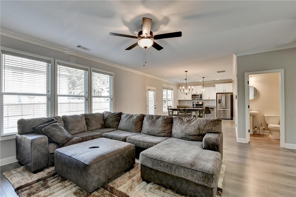 619 Garner Street Buford, GA 30518 - Photo 13 of 45 a living room with furniture and a large window