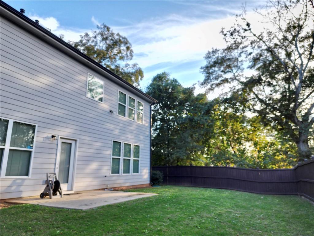 619 Garner Street Buford, GA 30518 - Photo 41 of 45 a view of a backyard with a garden and plants
