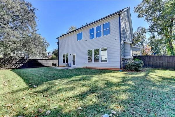 a house view with a backyard space