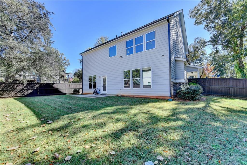 619 Garner Street Buford, GA 30518 - Photo 44 of 45 a house view with a backyard space