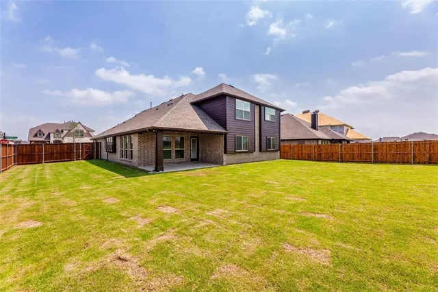 a front view of house with an outdoor space and balcony