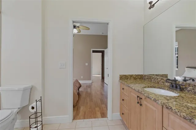 a bathroom with a toilet and a bath tub