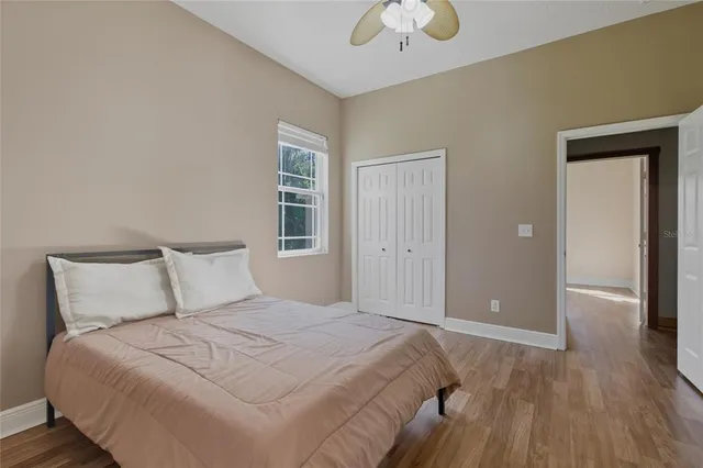 a bedroom with a bed and window