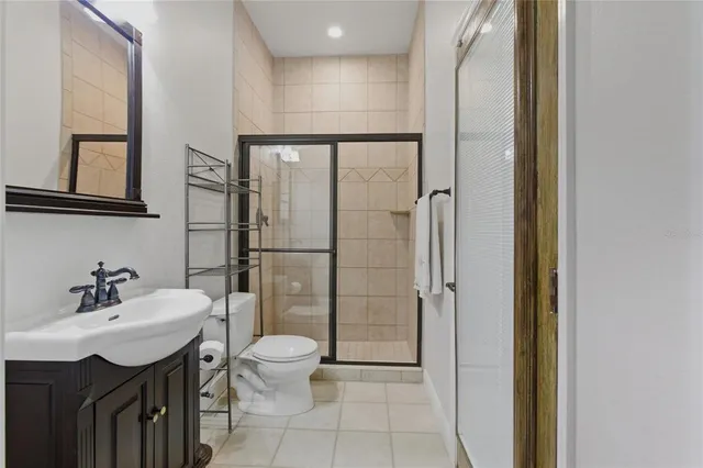 a living room with furniture and two large window