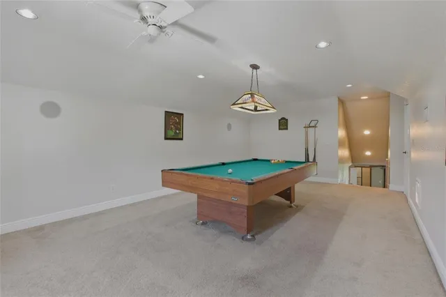 a living room with large windows a rug and a floor to ceiling window