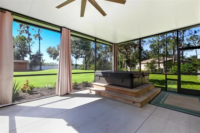 an aerial view of multiple houses with yard