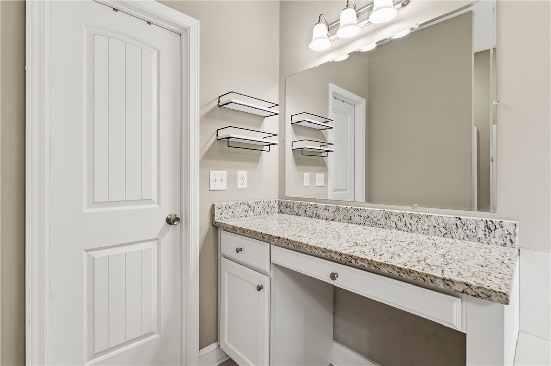 1411 Dunn Road Anderson, SC 29625 - Photo 19 of 30 This bright bathroom features ample counter space and well-placed lighting for everyday routines.