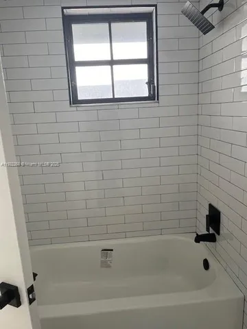 a bathroom with a bathtub