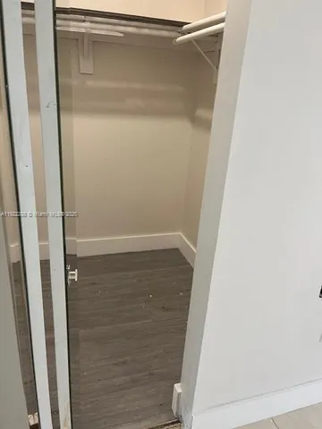 a bathroom with a sink toilet and mirror