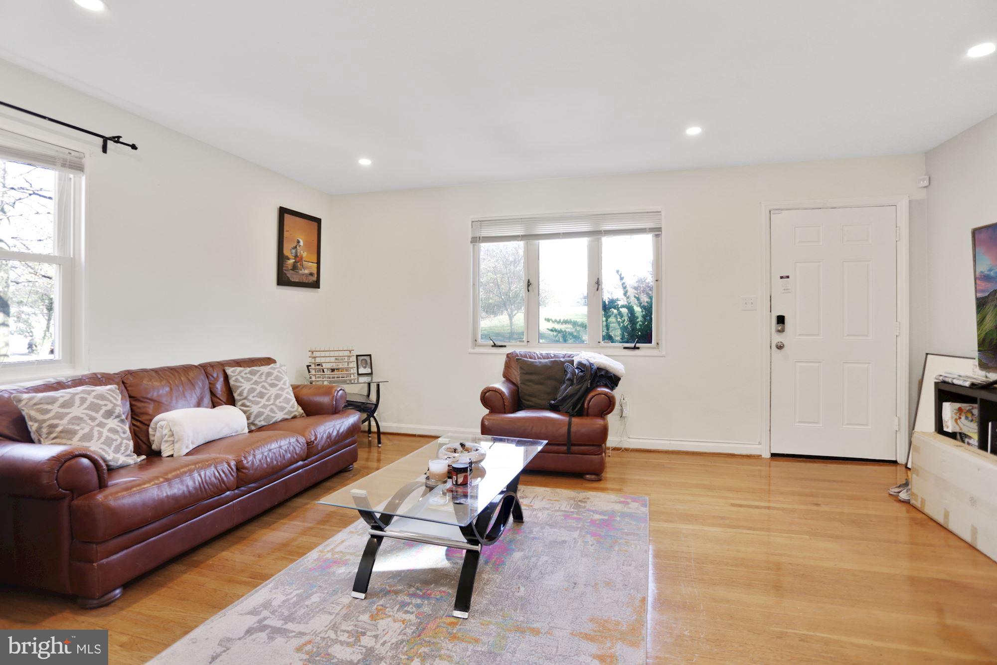 4910 Sargent Road Northeast Washington, DC 20017 - Photo 9 of 16 a living room with furniture and wooden floor