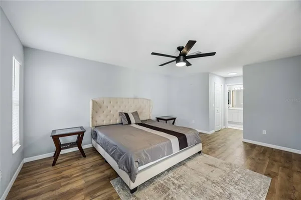 a bedroom with a bed and a table in it