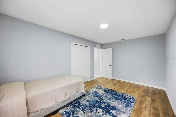 a spacious bedroom with a bed